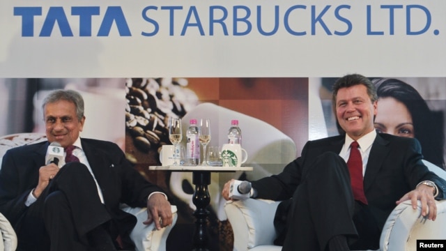 Vice Chairman of Tata Global Beverages R.K. Krishna Kumar and President of Starbucks China and Asia Pacific John Culver (R) attend a news conference in Mumbai, January 30, 2012. 