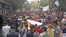 Demonstrators protest against Syria's President Bashar Al-Assad after Friday prayers in Yabroud, near Damascus, May 11, 2012.