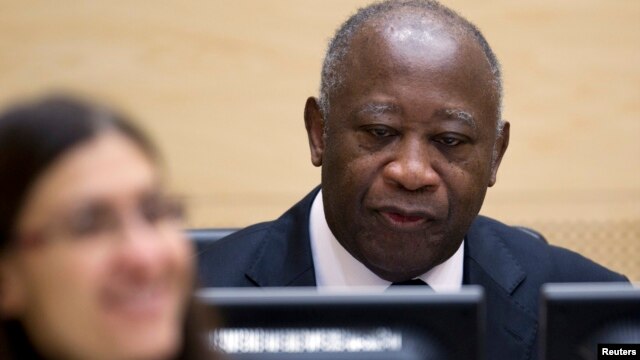 Ivory Coast's former president Laurent Gbagbo waits for the judges to arrive for his initial court appearance at the International Criminal Court in The Hague, December 5, 2011. 