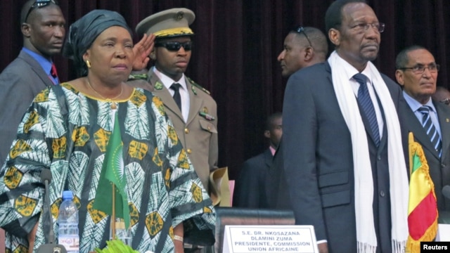 African Union Chief Nkosazana Dlamini-Zuma (front L) and Mali's President Dioncounda Traore attend a high level international meeting in Bamako, October 19, 2012. Regional leaders joined international organisations in Bamako on Friday trying to narrow their differences over whether al Qaeda-linked Islamists in the north of Mali should be dislodged via military intervention or a more gradual political approach. REUTERS/Adama Diarra  