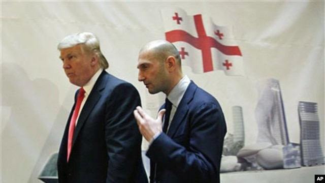 Real estate developer Donald Trump, left, and George Ramishvili, Chairman of Silk Road Group, talk following a news conference in New York, March 10, 2011