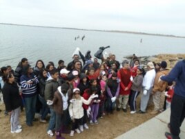 The group prepares to end the cleanup with a Hindu prayer.