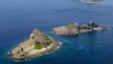 FILE - Part of a group of disputed islands, Minamikojima (bottom) and Kitakojima, known as Senkaku in Japan and Diaoyu in China, seen in the East China Sea, in this photo taken by Kyodo.