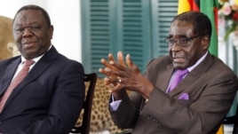 Zimbabwean President Robert Mugabe (R) and Prime Minister Morgan Tsvangirai address a media conference at State House in Harare, January 17, 2013.