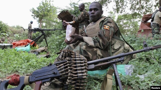 Ugandan soldiers serving with African Union Mission in Somalia take a break during patrols in Lafole village, near Afgoye district in Mogadishu, May 27, 2012. 