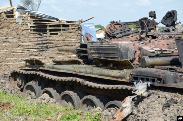 FILE - Tanks that have been destroyed during fighting between forces of Salva Kiir and Riek Machar, July 10, 2016 in Jabel area of Juba, South Sudan, July 16, 2016.