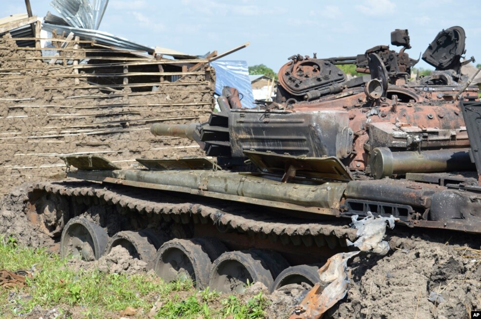 FILE - Tanks that have been destroyed during fighting between forces of Salva Kiir and Riek Machar, July 10, 2016 in Jabel area of Juba, South Sudan, July 16, 2016.