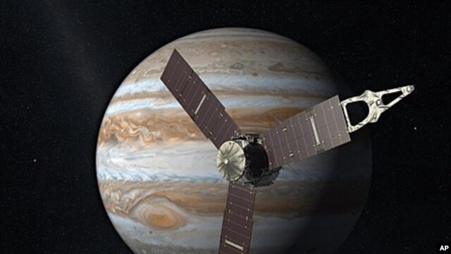 NASA's Juno spacecraft passes in front of Jupiter in this artist's depiction