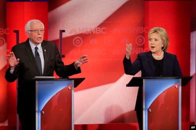 Democratic presidential candidate Senator Bernie Sanders and former Secretary of State Hillary Clinton spar during a presidential primary debate at the University of New Hampshire in Durham, Feb. 4, 2016.