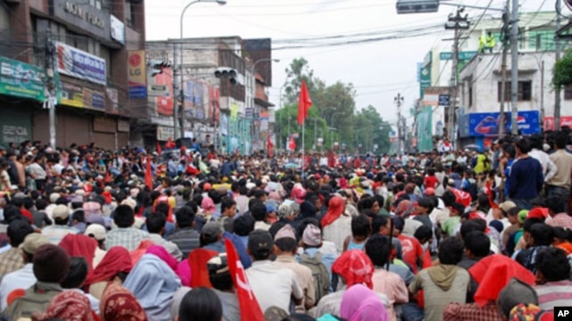 Thousands of Maoist supporters rally in what is normally one of Kathmandu's busiest streets near the government center, 05 May 2020