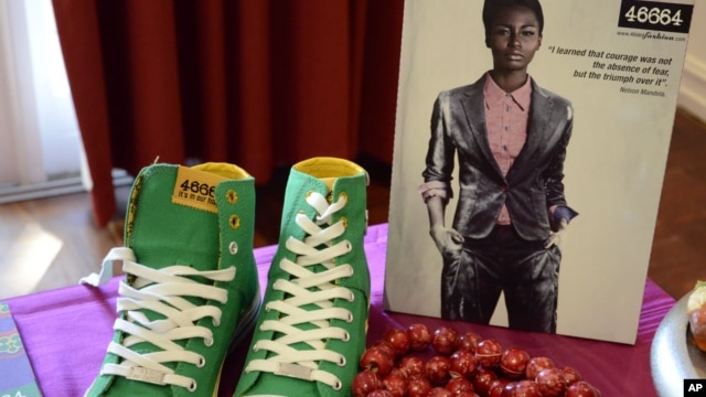Green casual shoes and a red beaded necklace on show at a fashion range launch, inspired by South African President Nelson Mandela's 94th birthday in Johannesburg, June 29, 2012.  
