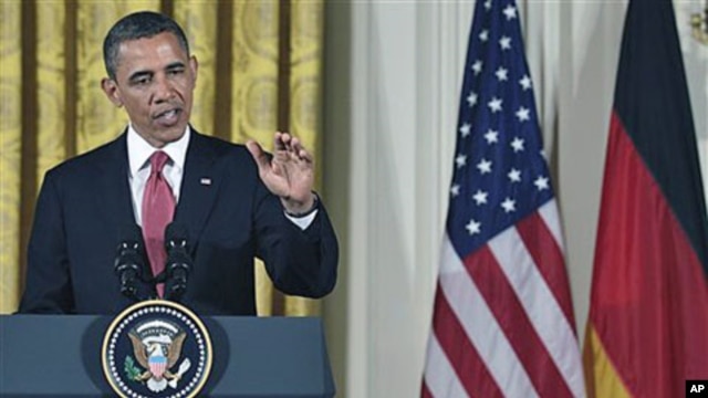 President Barack Obama answers a question during a joint news conference with German Chancellor Angela Merkel in the East Room of the White House in Washington, DC, June 7, 2011