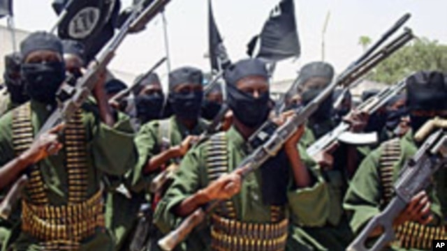 Al-Shabab fighters march with their guns during military exercises on the outskirts of Mogadishu (File)