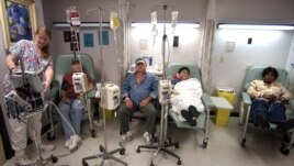 Cancer patients receive chemotherapy at Parkland Memorial Hospital in Dallas. A new, experimental treatment for lymphoma could allow patients to forgo the often agonizing ordeal of chemotherapy. (AP Photo/Tony Gutierrez)