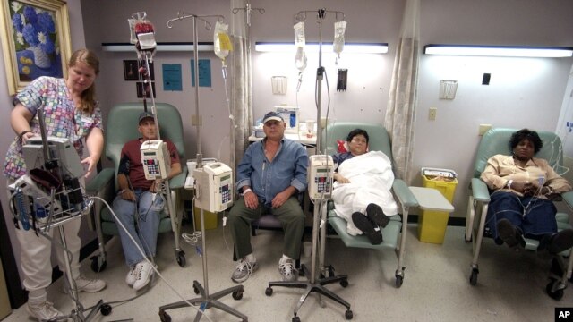 Cancer patients receive chemotherapy at Parkland Memorial Hospital in Dallas. A new, experimental treatment for lymphoma could allow patients to forgo the often agonizing ordeal of chemotherapy. (AP Photo/Tony Gutierrez)