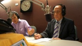 Mam Sonando took questions Monday by phone from the audience in Cambodia and through Facebook. He’s pictured here with the radio call-in program host, Men Kimseng. (Im Sothearith / VOA Khmer)