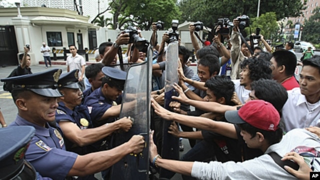 Protesters clash with riot police and U.S. Embassy guards as the former rush towards the embassy gates to protest the joint U.S.-Philippines military exercises dubbed "Balikatan 2011," which opened in Manila, Philippines, April 5, 2011.