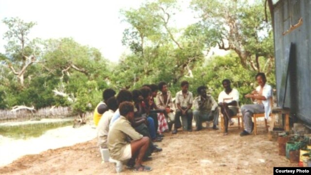 Dr. Sato explains the importance of pH or acidity to students in Eritrea