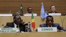 Front row, left to right,  Joseph Kabila Kabange  President of the Democratic Republic of Congo, and Denis Sanssou N'guesso, President of the Republic of Congo, during the signing of the Congo peace deal in Addis Ababa, Ethiopia, Sunday, Feb. 24, 2013. Eleven African countries have signed a United Nations-drafted peace deal to stabilize the troubled Central African country of Congo, where rebels allegedly backed by neighbouring countries last year threatened to oust the government.  Opening the signing ceremony in Ethiopia on Sunday, U.N. Secretary-General Ban Ki-moon said the peace, security and co-operation framework for Congo would bring stability to the region. In the background are Ethiopian Prime Minister Haile Mariam Desalegne, left and United General Secretary Ban Ki- moon.  (AP Photo/ Elias Asmare)