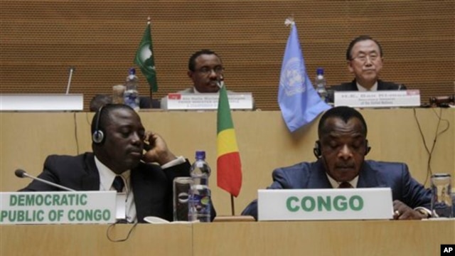 Front row, left to right,  Joseph Kabila Kabange  President of the Democratic Republic of Congo, and Denis Sanssou N'guesso, President of the Republic of Congo, during the signing of the Congo peace deal in Addis Ababa, Ethiopia, Sunday, Feb. 24, 2013. Eleven African countries have signed a United Nations-drafted peace deal to stabilize the troubled Central African country of Congo, where rebels allegedly backed by neighbouring countries last year threatened to oust the government.  Opening the signing ceremony in Ethiopia on Sunday, U.N. Secretary-General Ban Ki-moon said the peace, security and co-operation framework for Congo would bring stability to the region. In the background are Ethiopian Prime Minister Haile Mariam Desalegne, left and United General Secretary Ban Ki- moon.  (AP Photo/ Elias Asmare)