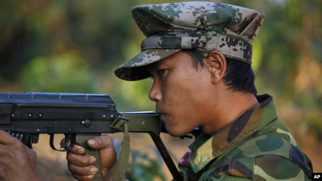 In this photo taken on Feb. 13, 2012, a Kachin soldier mans a frontline position, facing off against the Burmese government.