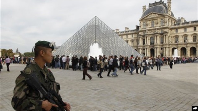 French soldiers patrol around the Louvre museum in Paris, Sunday, Oct. 3, 2010. The State Department has cautioned Americans traveling in Europe to be vigilant because of heightened concerns about a potential al-Qaida terrorist attack aimed at U.S. citize
