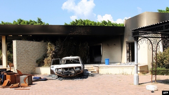 Burnt house, car inside U.S. embassy compound following overnight attack, Benghazi, Sept. 12, 2012.