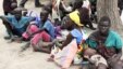  FILE - Residents displaced by fighting between government and rebel forces are seen at a World Food Program (WFP) outpost in Kuernyang Payam, South Sudan, May 2, 2015. 