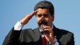 Venezuela's Vice President Nicolas Maduro speaks to thousands of supporters of Venezuela's late President Hugo Chavez as they wait to view his body in state at the Military Academy in Caracas March 7, 2013. Chavez, a former paratrooper, died on Tuesday ag