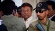 Pakistan's former president and military ruler Pervez Musharraf, center, leaves after appearing in court in Rawalpindi, Pakistan, April 17, 2013. 
