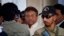 Pakistan's former president and military ruler Pervez Musharraf, center, leaves after appearing in court in Rawalpindi, Pakistan, April 17, 2013.