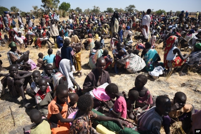 FILE - Some of more than 30,000 people who flocked into Leer town, South Sudan, to receive food from the International Committee of the Red Cross, Dec. 15, 2015, which marks the two-year anniversary of South Sudan's civil war.