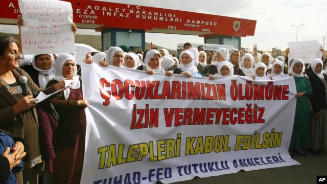 Kurdish women demonstrate near a prison in Sincan, on the outskirts of Ankara, Turkey, Friday, Nov. 2, 2012.