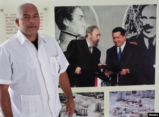 FILE - Cuban nurse Guillermo Ballines a day before his departure for Liberia during the Ebola crisis poses for a picture in Havana, Oct. 21, 2014.