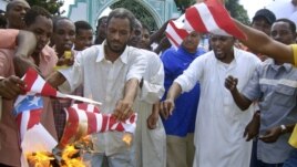 A group of Kenyan muslims burn the U.S. flag following afternoon prayers outside the Sakina Jamia Mosque in the port city of Mombasa, Sept. 14, 2012.
