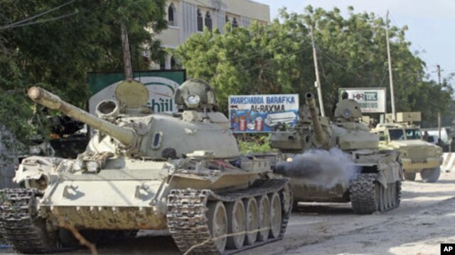 African Union Mission in Somalia [AMISOM] tanks patrol after fighting against Islamist insurgents al-Shabab, in Suqa Holaha village of Horiwaa district, Mogadishu, Somalia, March 3, 2012.