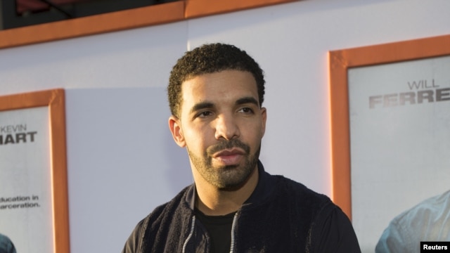 FILE - Rapper Drake poses at the premiere of "Get Hard" at the TCL Chinese theatre in Hollywood, California.