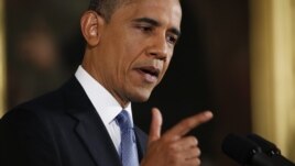 U.S. President Barack Obama gestures while addressing his first news conference since his re-election, at the White House in Washington, November 14,  2012. 