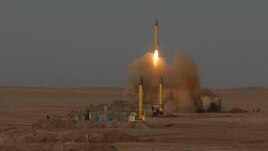 In this Tuesday, July 3, 2012 file photo released by the Iranian Fars News Agency, a surface-to-surface missile is launched during an Iranian Revolutionary Guard maneuver in an undisclosed location in Iran.