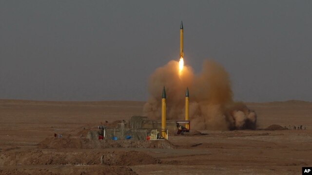 In this Tuesday, July 3, 2012 file photo released by the Iranian Fars News Agency, a surface-to-surface missile is launched during an Iranian Revolutionary Guard maneuver in an undisclosed location in Iran.