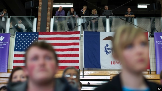 Voters look on as Democratic presidential candidate Sen. Bernie Sanders speaks during a campaign a campaign event, Jan. 29, 2016, in Mt. Pleasant, Iowa