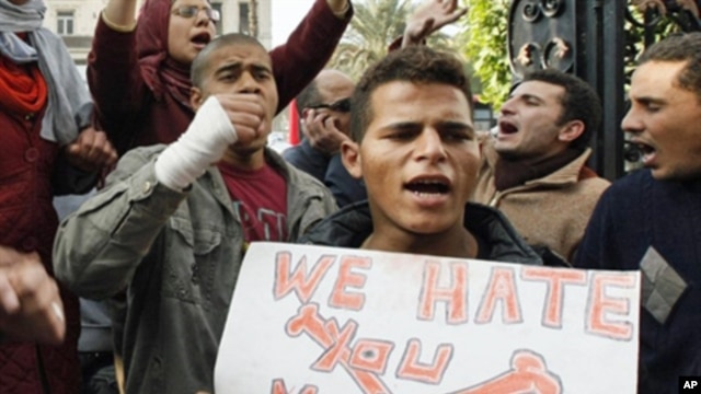 Anti-government demonstrators shout slogans against President Hosni Mubarak in Cairo, Egypt, January 27, 2011.