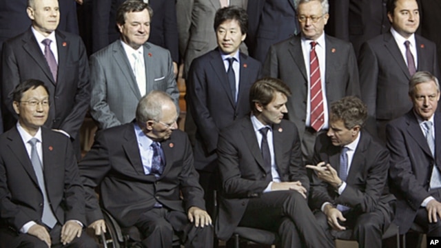 G20 finance ministers are gathered for a group picture  at the French Finance Ministry  in Paris,  Oct. 15, 2011.