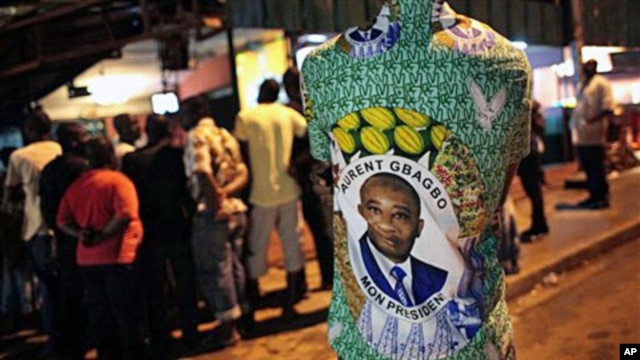 A supporter of President Laurent Gbagbo watches election results in Abidjan (File)