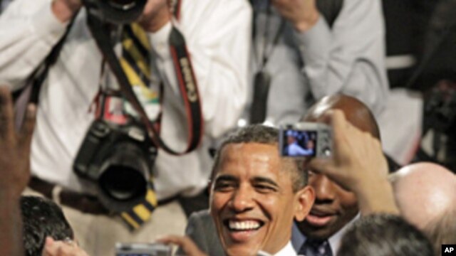 President Barack Obama shakes hands and poses for photos after speaking about the American Jobs Act at Eastfield College in Mesquite, Texas, Oct. 4, 2011