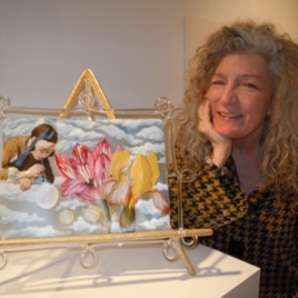 Artist Ginny Ruffner with one of her vibrant glass works.