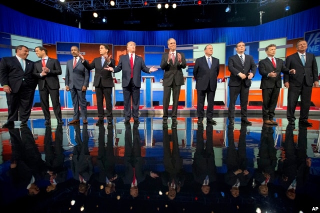 Republican presidential candidates, from left, Chris Christie, Marco Rubio, Ben Carson, Scott Walker, Donald Trump, Jeb Bush, Mike Huckabee, Ted Cruz, Rand Paul and John Kasich take the stage for their debate at Quicken Loans Arena in Cleveland, Aug. 6, 2015.