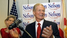 U.S. Sen. Bill Nelson, D-Fla. thanks supporters at a re-election party in Orlando, Florida, Tuesday, Nov. 6, 2012. On his left, is wife Grace Nelson.