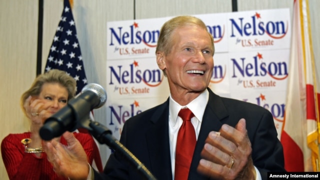 U.S. Sen. Bill Nelson, D-Fla. thanks supporters at a re-election party in Orlando, Florida, Tuesday, Nov. 6, 2012. On his left, is wife Grace Nelson.