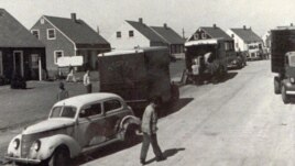People move into new homes in Levittown, New York, in October 1947. Levittown served as a model for planned communities for the baby boom generation.